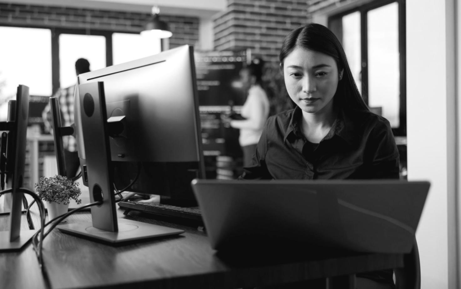 Professional demonstrating network troubleshooting techniques on multiple computer systems